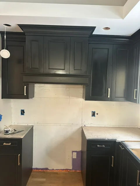 Custom kitchen cabinetry with range hood