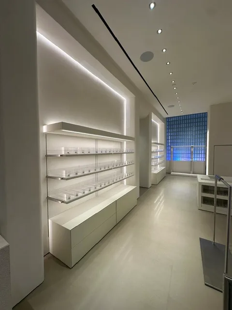 LED-lit retail wall shelving built by Elite Construction Group